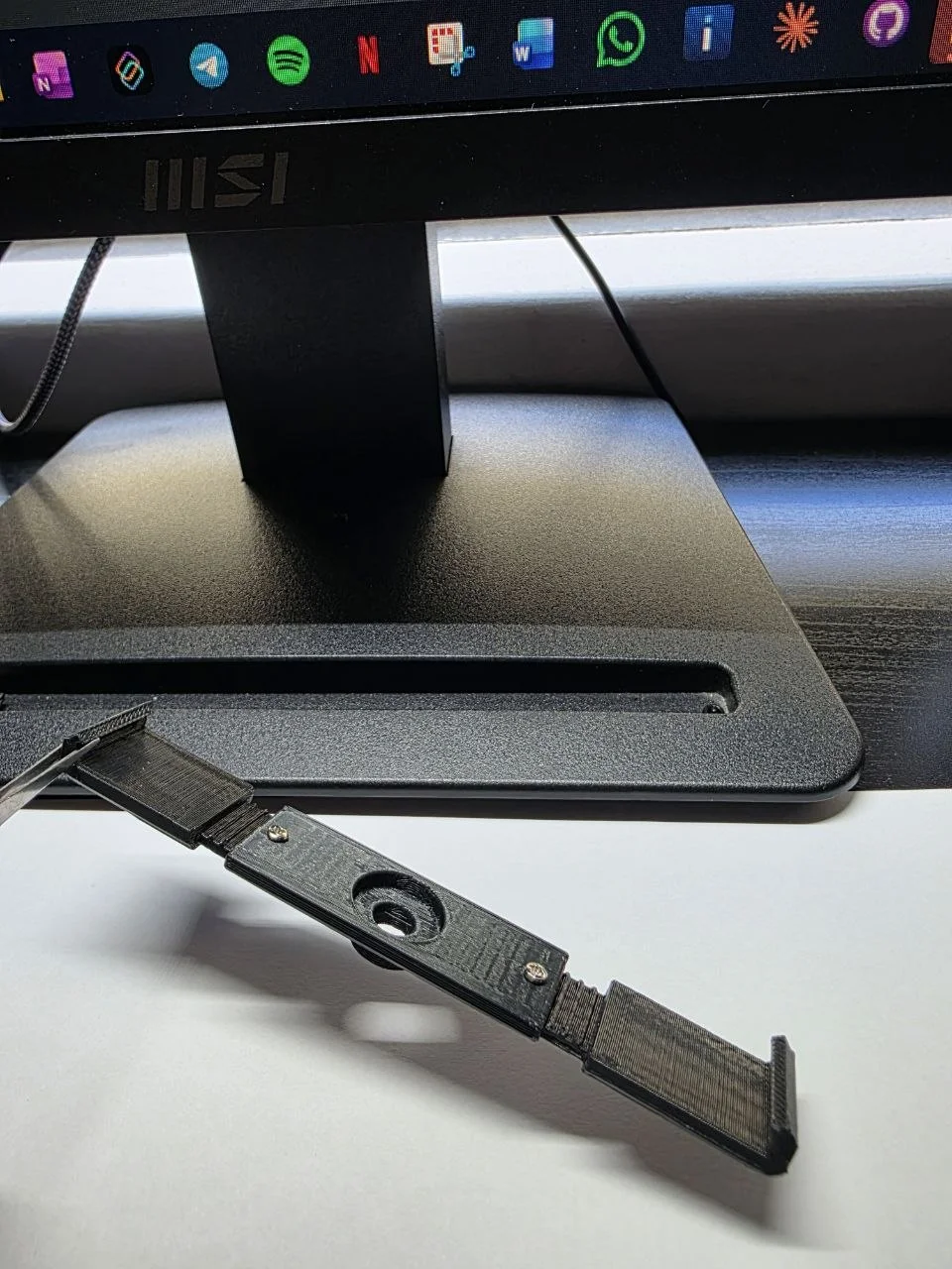 Adjustable rear holder — printed, close-up of sliding mechanism